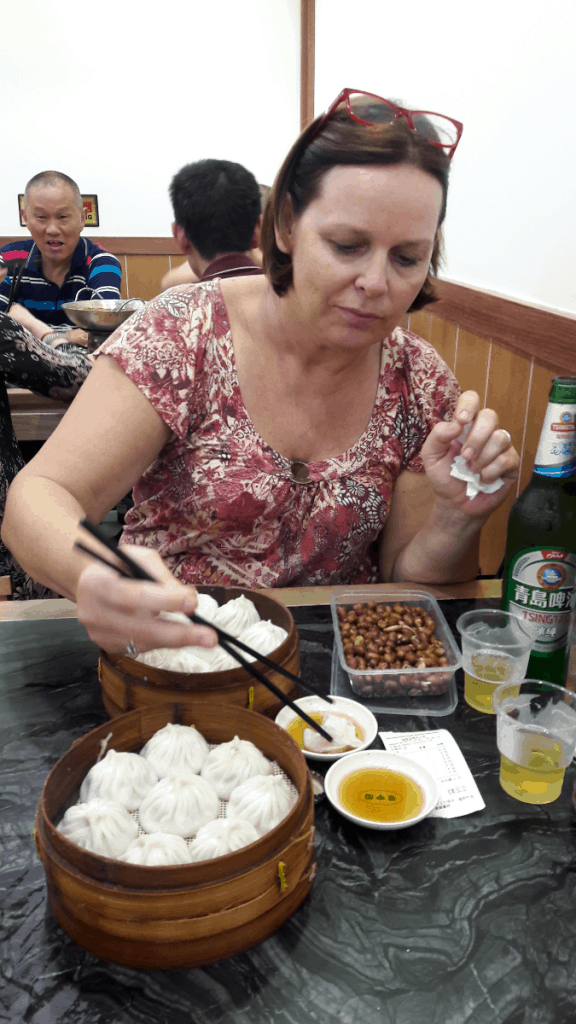 girl eating Chinese dumplings