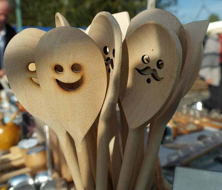 wooden spoons smiling to have fun while cooking