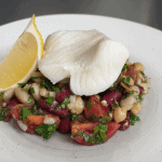 Poached snow fish with mixed bean salad and bacon dressing