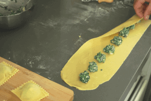 spoon ravioli on the pasta sheet
