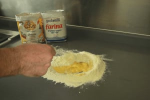 fresh pasta beat egg in semolina flour