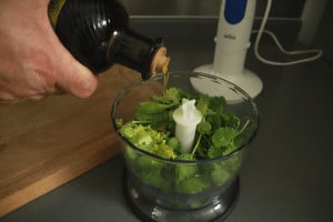 add olive oil to ingredients for pesto