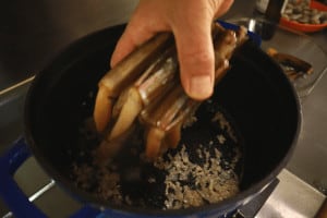 add razor clams to the cooking pot