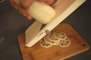slicing lotus root with a mandoline