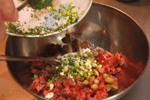 mixing ingredients for beef tartare
