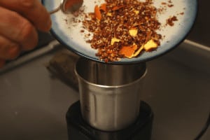 add toasted spices into a grinder
