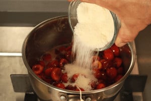 adding sugar to cherries