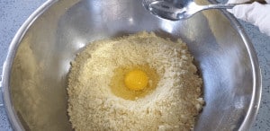 mix egg into mixed flour and butter