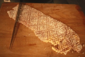 marking a veal escalope with the back of a knife