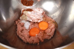 mix meat with spices for meatloaf