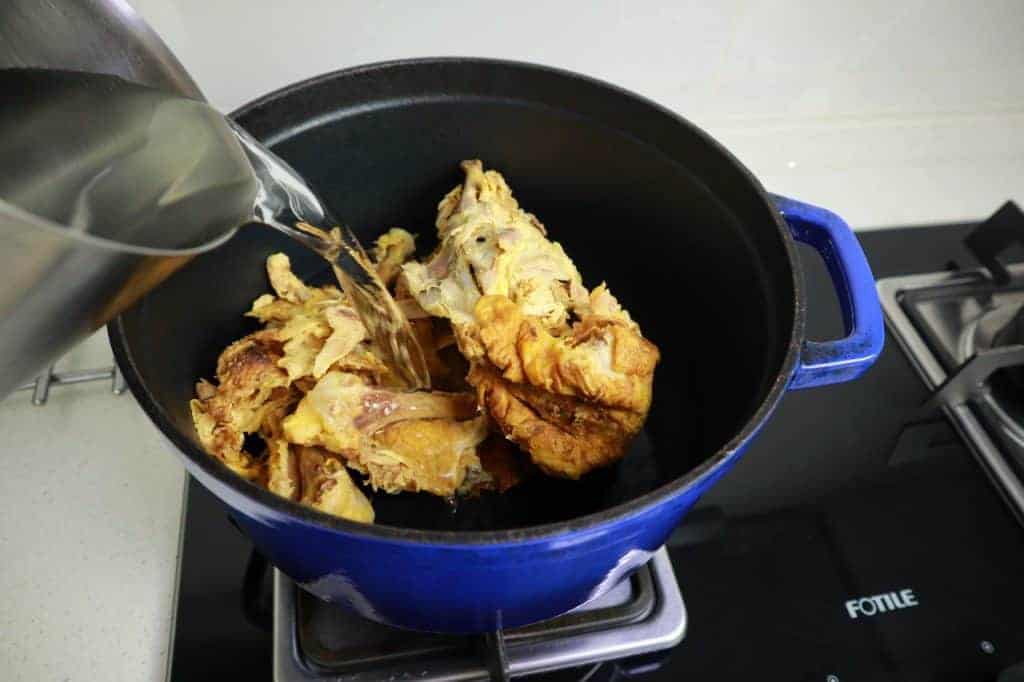 adding water to chicken carcasses