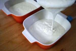 Bechamel sauce pouring in oven dish