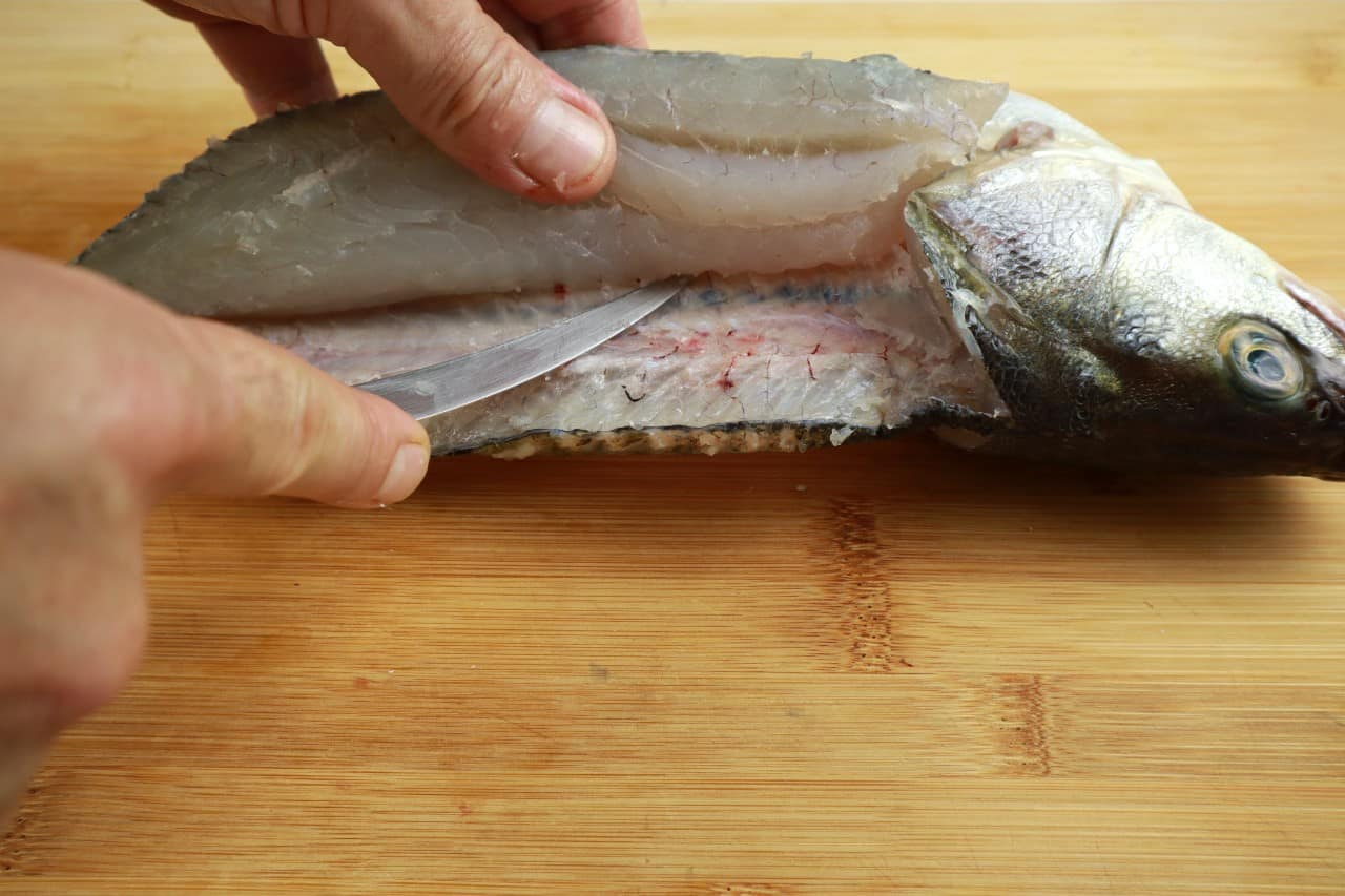 filleting round fish release the fillets how to fillet a round fish - filleting round fish 12 finish filleting - How to Fillet a Round Fish