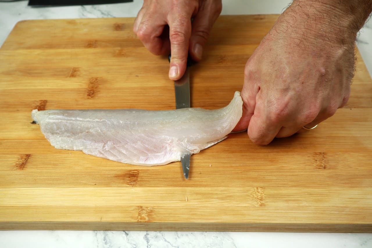 filleting round fish how to fillet a round fish - filleting round fish 14 take skin off - How to Fillet a Round Fish