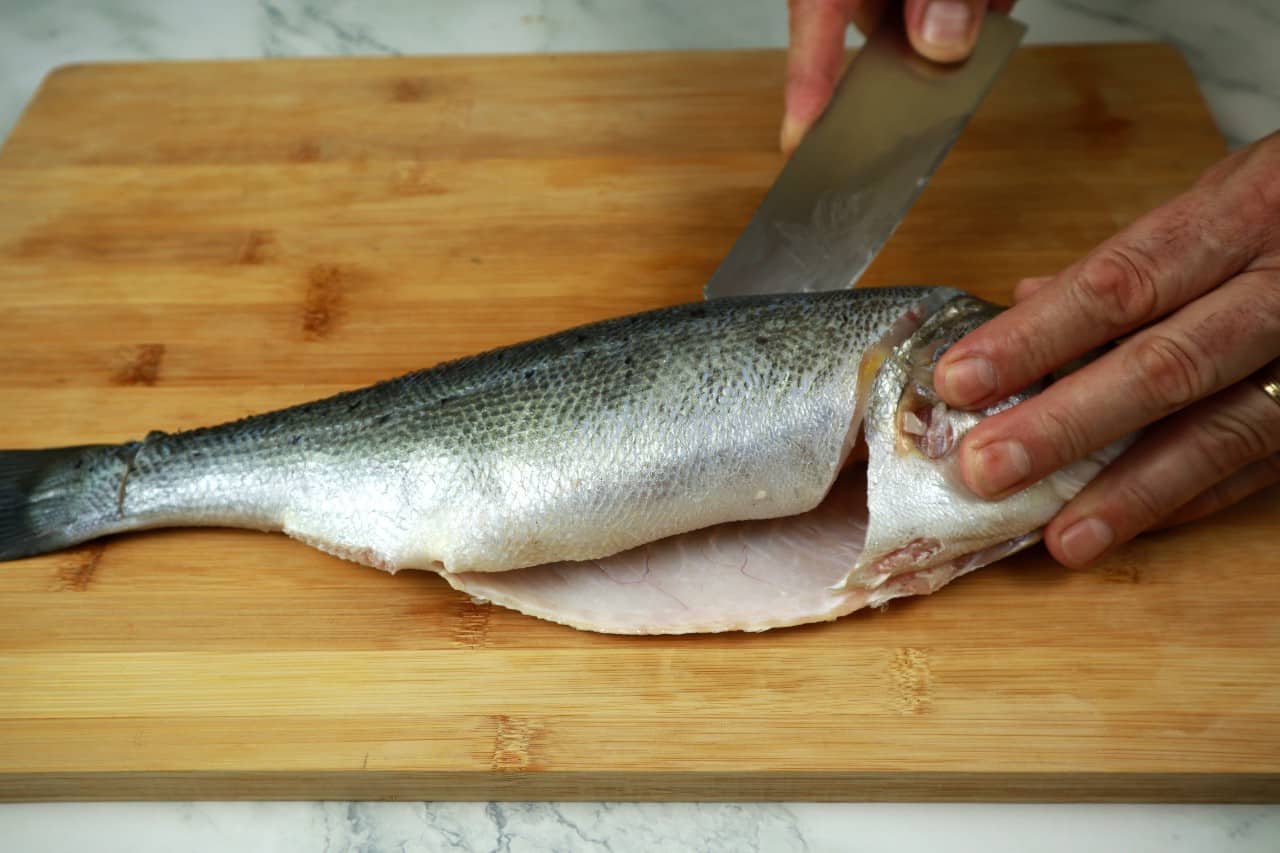 filleting round fish cut along the bone how to fillet a round fish - filleting round fish 9 start filleting - How to Fillet a Round Fish
