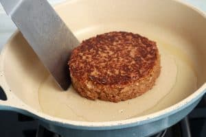 pan frying a vegan burger