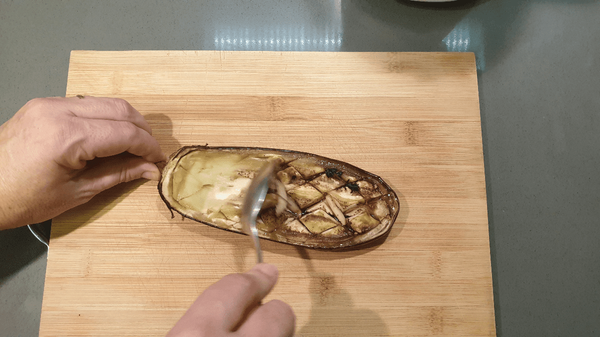 scoop flesh from eggplants
