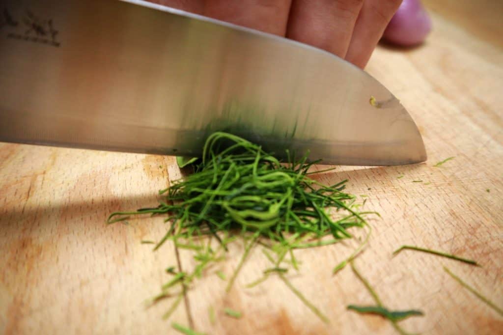 cutting kaffir leaves