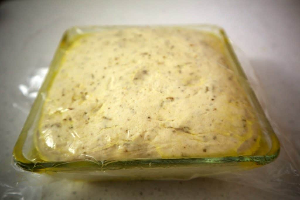 resting focaccia dough with oil