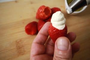 fill strawberries with a piping bag