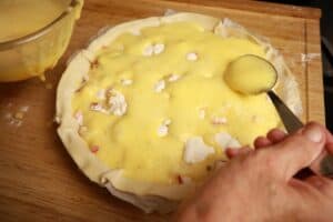 whipped eggs to cover the flour on the tart