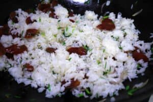 add rice to stir fried sausage