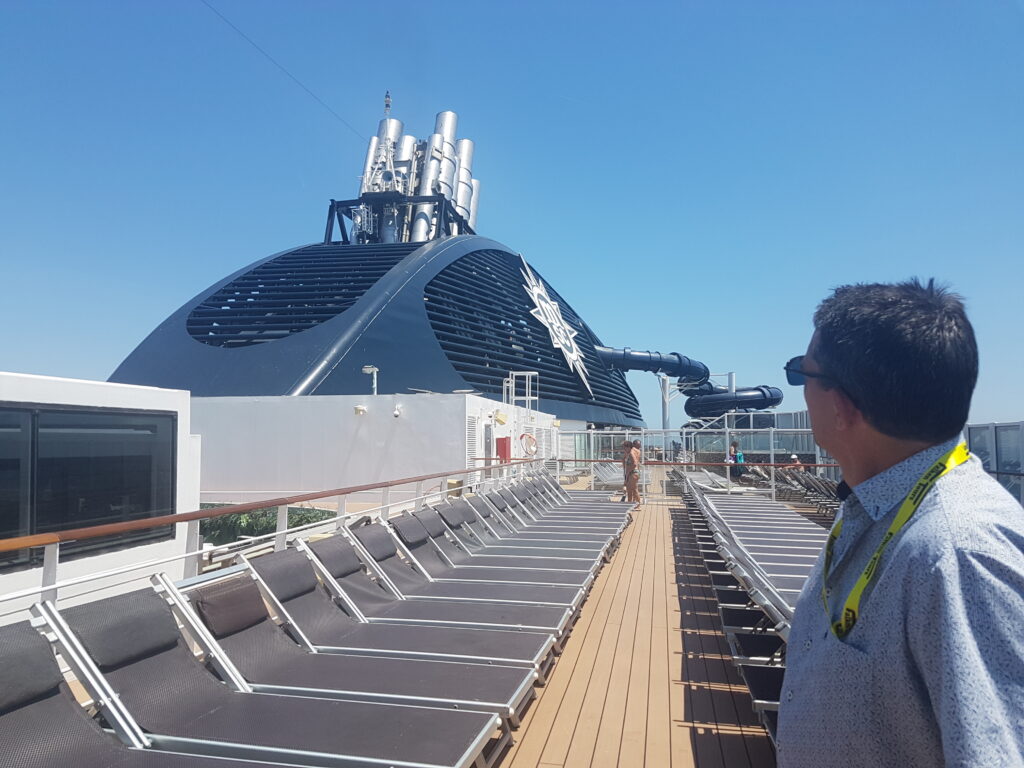 on the top deck of a cruise boat